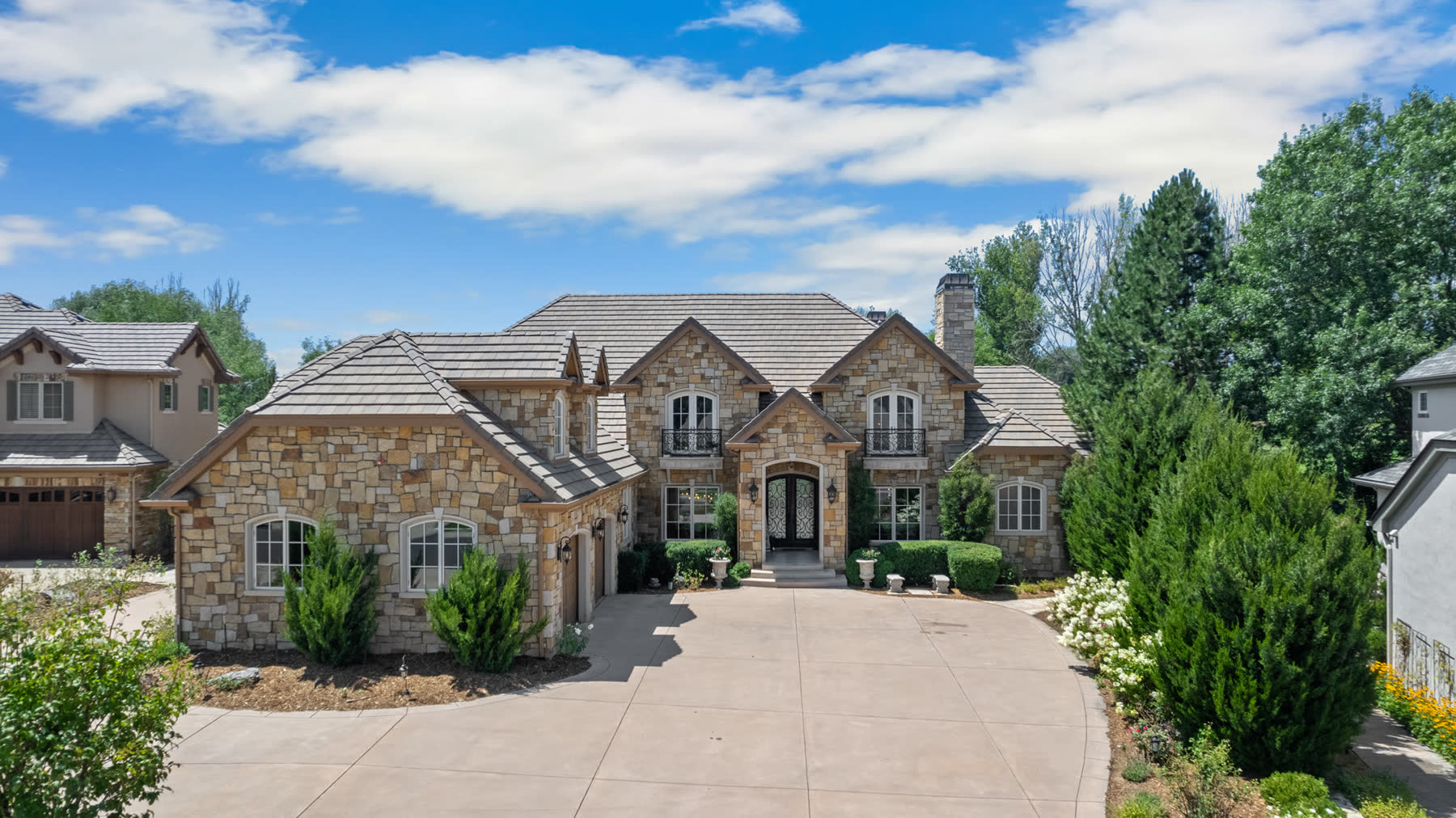 Stone estate with a circular drive