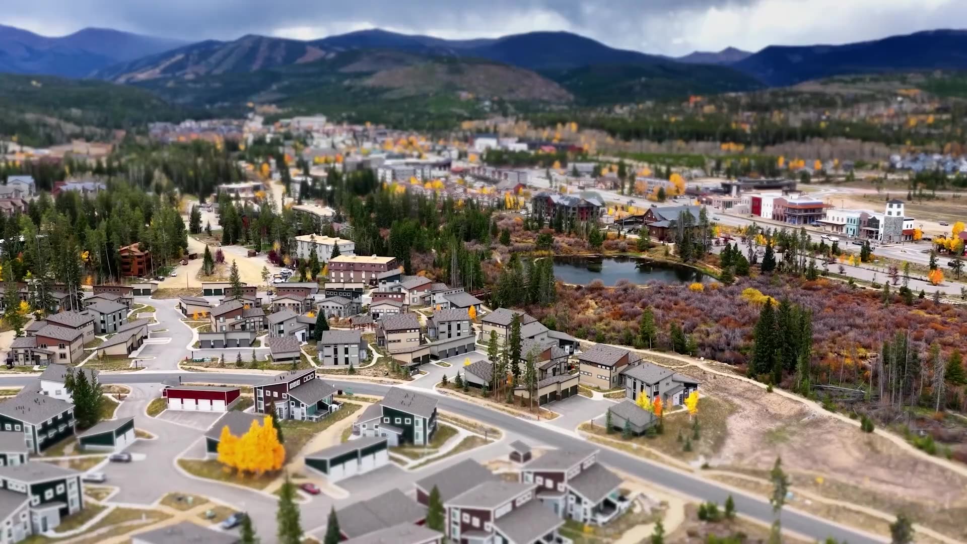 Aerial view of Riverwalk townhomes in Fraser with mountains behind